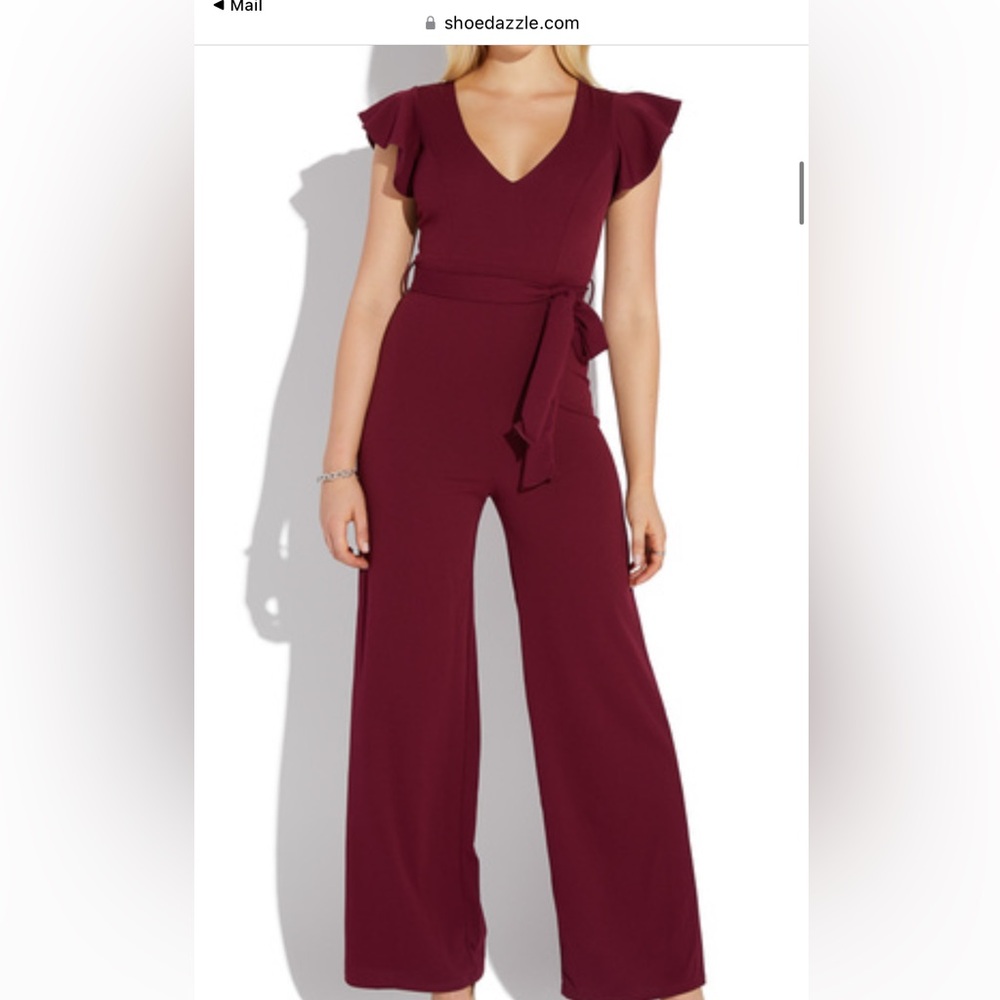 Bellbottoms  jumper  no snags no stains wraparound belt zipper in the back